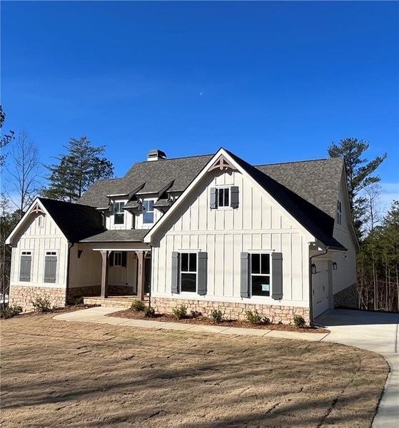 Front exterior of a new home in , Waleska, GA, highlighting curb appeal (Image 1). Front exterior of a new home in , Waleska, GA, highlighting curb appeal (Image 1).