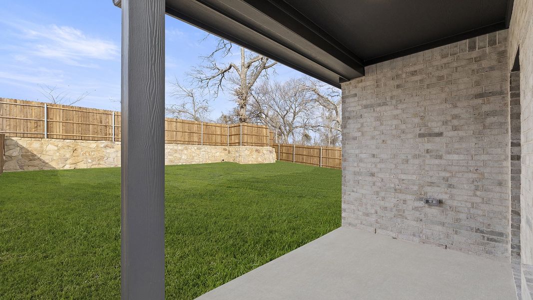 Exterior details and patio area of a home in Keeneland 50s, Aubrey (Image 3).