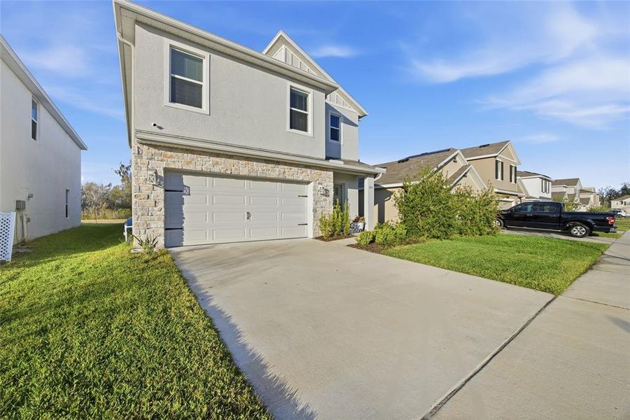 Front exterior of a new home in , Plant City, FL, highlighting curb appeal (Image 23). Front exterior of a new home in , Plant City, FL, highlighting curb appeal (Image 23).