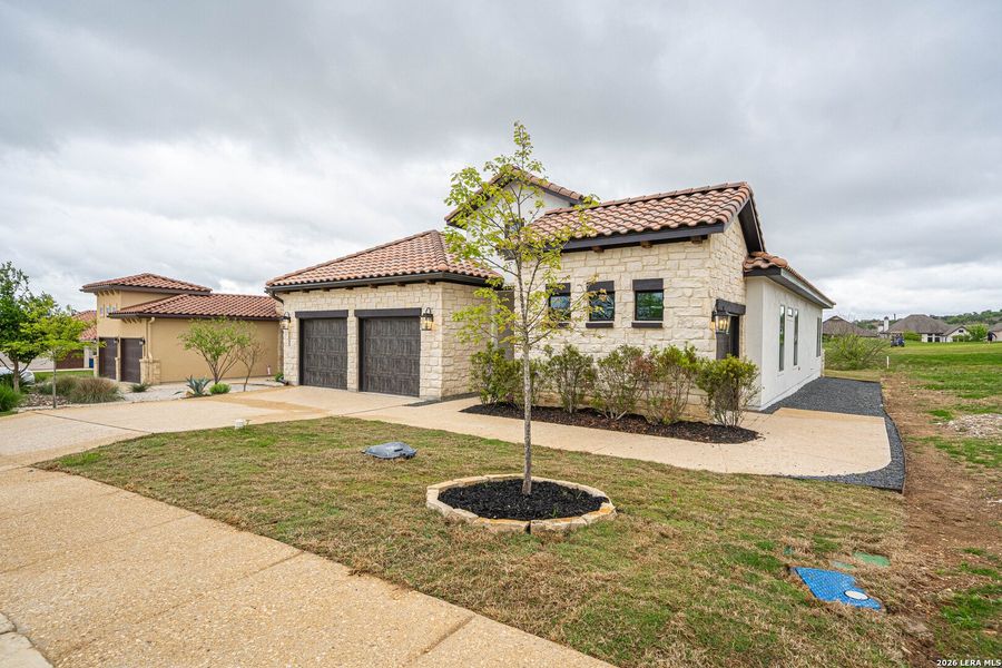 Front exterior of a new home in , Kerrville, TX, highlighting curb appeal (Image 21).