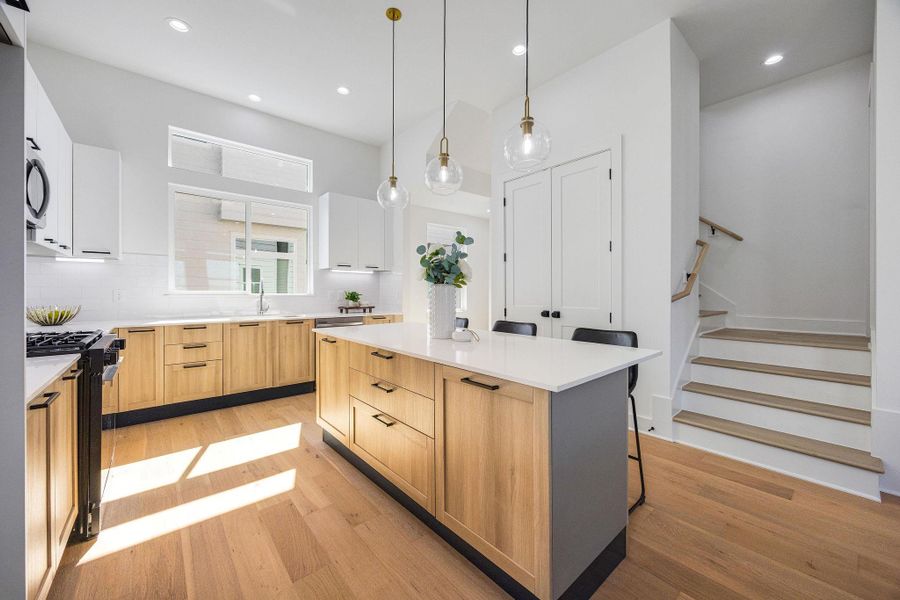 Spacious kitchen flooded with natural light, modern finishes, and endless storage.