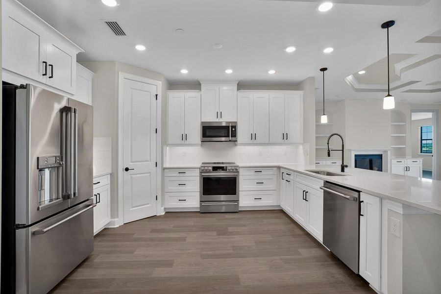 Furnished interior view inside a new home in Esplanade by the Islands Coach Homes, Naples (Image 10). Furnished interior view inside a new home in Esplanade by the Islands Coach Homes, Naples (Image 10).