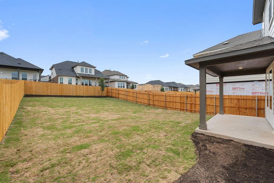 Exterior details and patio area of a home in Heritage, Dripping Springs (Image 22).
