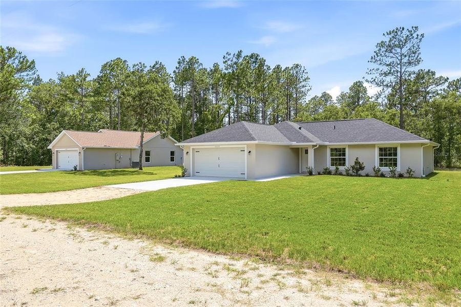 Front exterior of a new home in , Weeki Wachee, FL, highlighting curb appeal (Image 2). Front exterior of a new home in , Weeki Wachee, FL, highlighting curb appeal (Image 2).