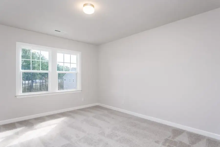 Spacious, unfurnished interior of a new home in The Townes at Willow Park, Cary (Image 16).