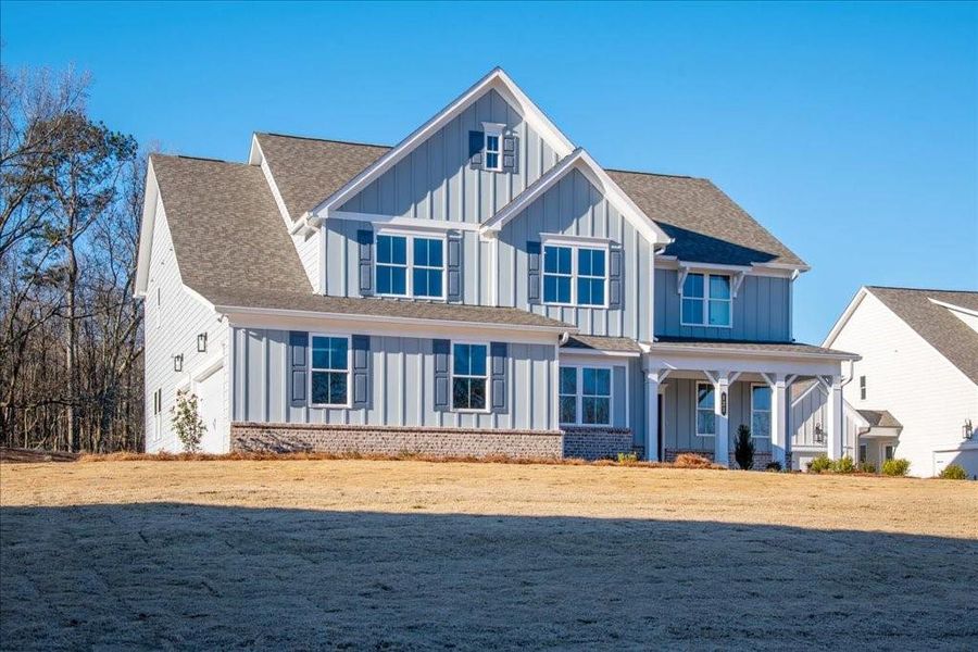 Front exterior of a new home in Autumn Brook, Canton, GA, highlighting curb appeal (Image 2).