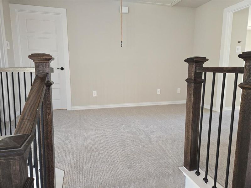 Staircase featuring carpet flooring