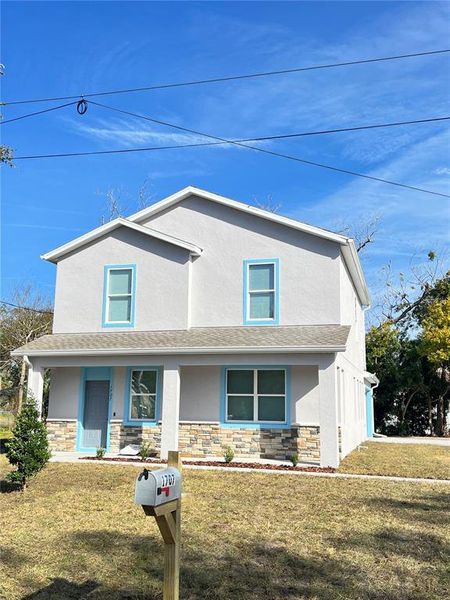 Front exterior of a new home in , Sanford, FL, highlighting curb appeal (Image 1).
