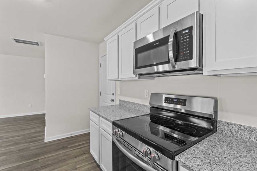 Representative furnished interior of a home built from the Cedar A by McGuinn Homes in Forts Ridge, Pelion (Image 6).
