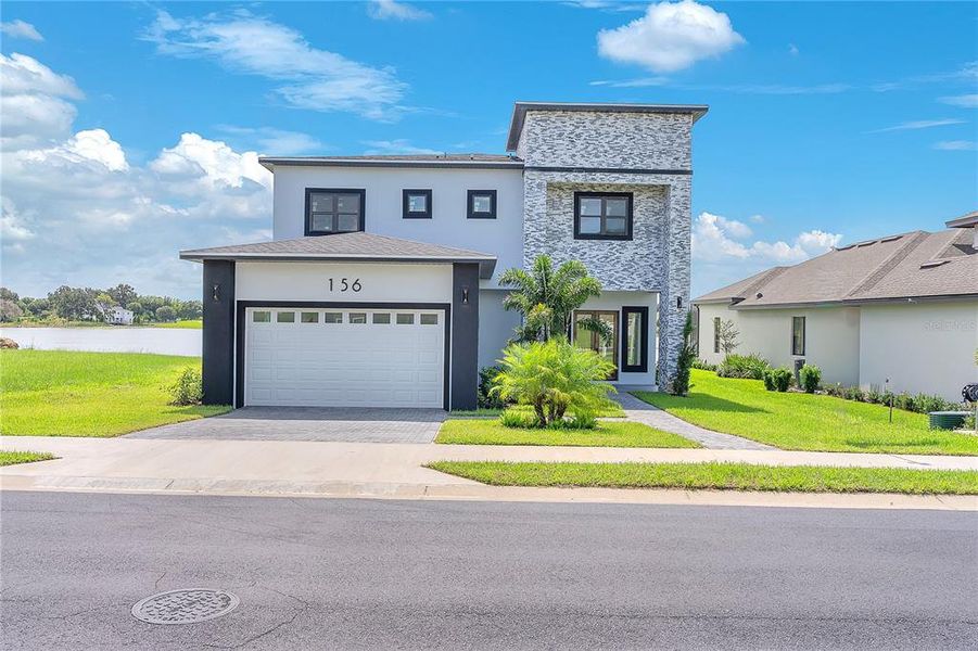 Front exterior of a new home in , Lake Alfred, FL, highlighting curb appeal (Image 30).