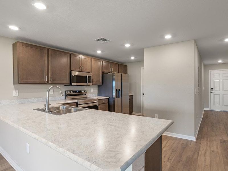 Choose from homes with warm wood or classic white finishes - Aruba townhome by Highland Homes