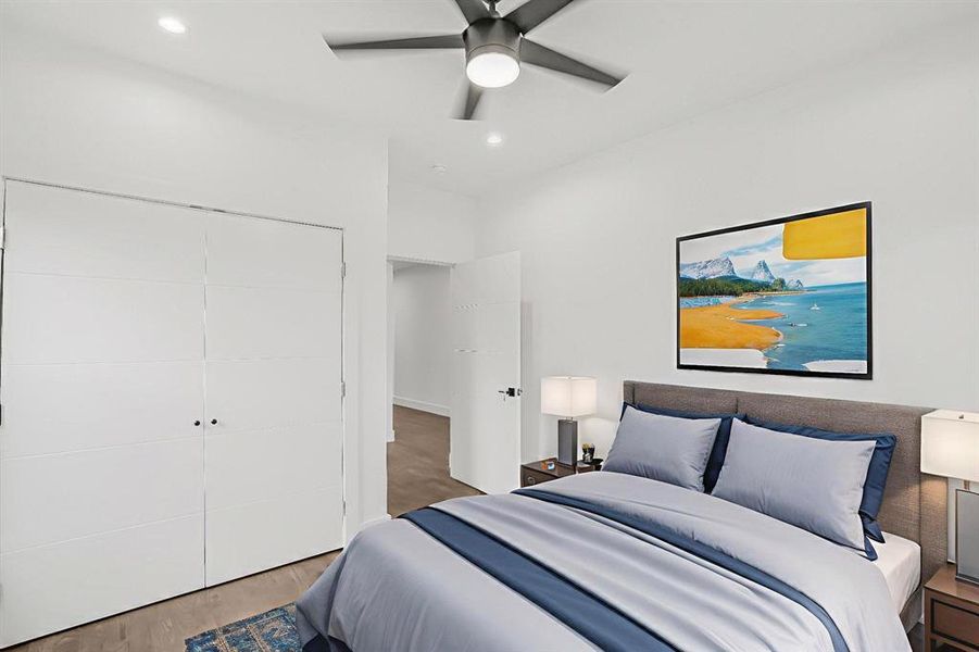 Bedroom featuring wood finished floors, recessed lighting, a closet, and ceiling fan