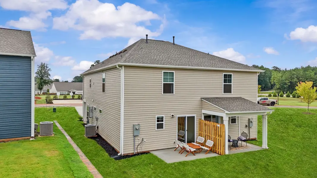 Exterior details and patio area of a home in Champions Village at Cherry Hill, Pendleton (Image 4).