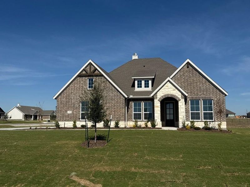 Front exterior of a new home in Fairview Meadows, New Fairview, TX, highlighting curb appeal (Image 1).