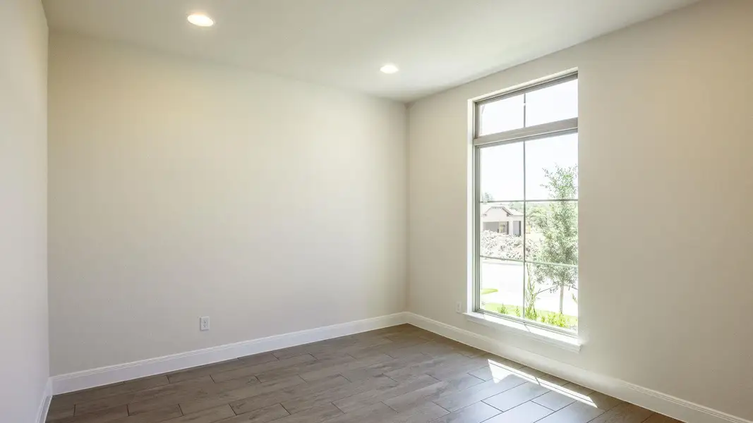 Unfurnished room featuring dark wood-style floors and recessed lighting Unfurnished room featuring dark wood-style floors and recessed lighting