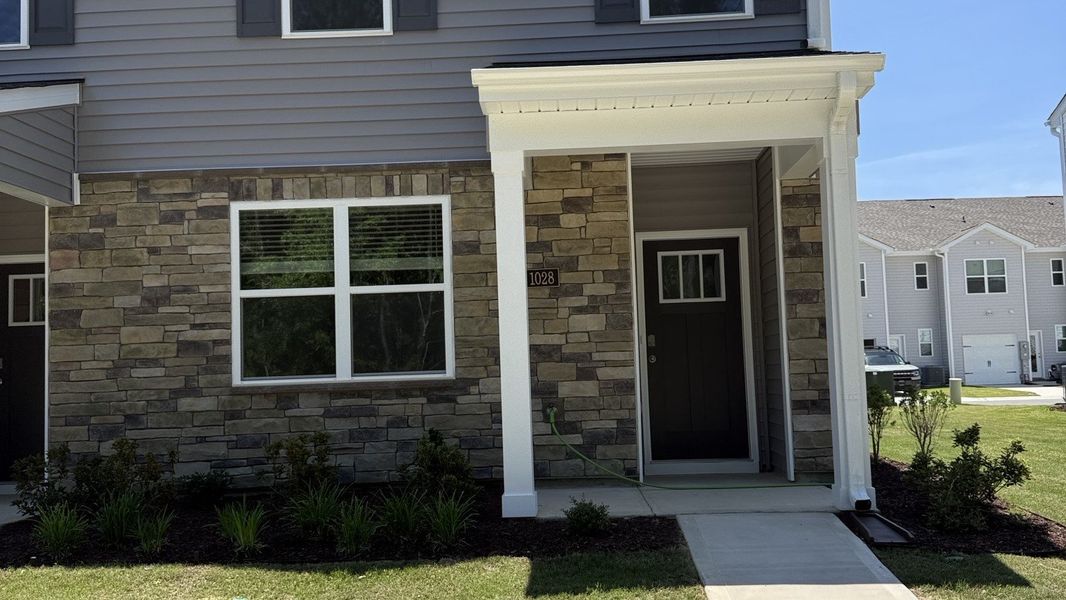 Exterior details and patio area of a home in Clock Road Townhomes, New Bern (Image 3).