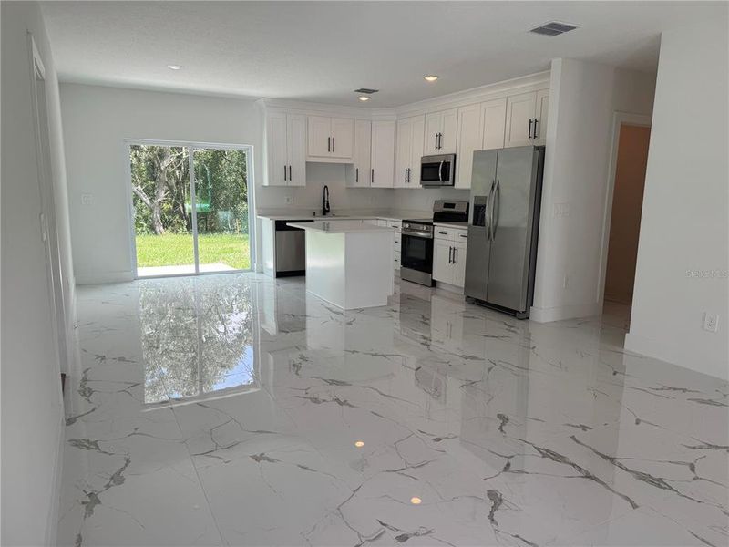 Furnished interior view inside a new home in , Dunnellon (Image 7).