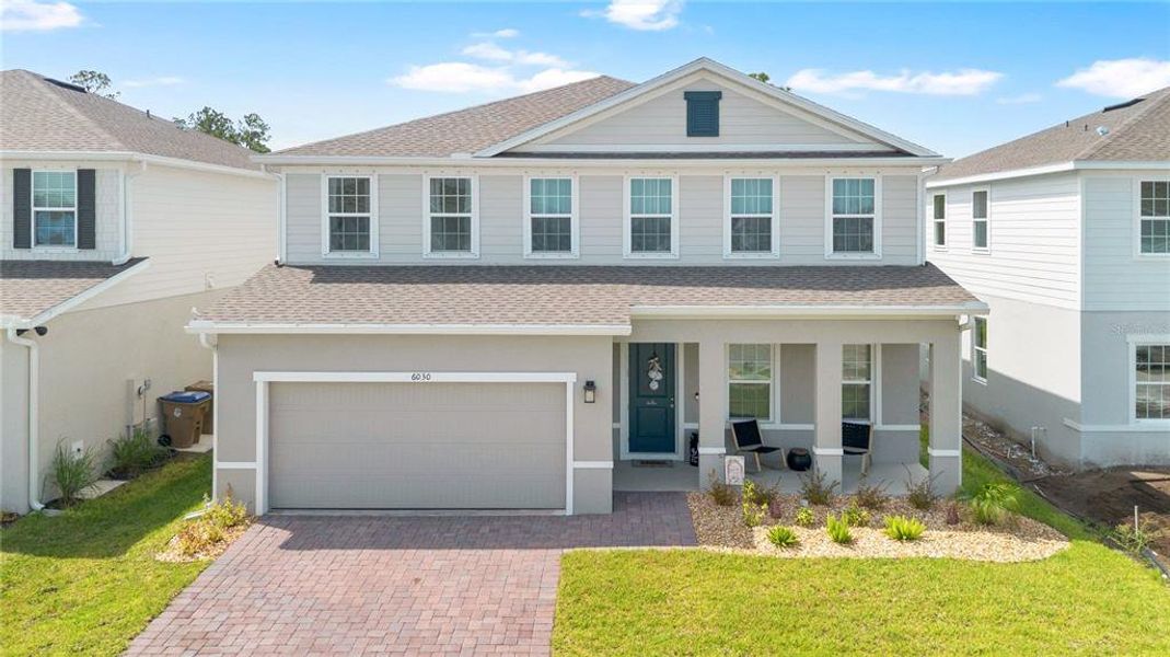 Front exterior of a new home in , St. Cloud, FL, highlighting curb appeal (Image 2). Front exterior of a new home in , St. Cloud, FL, highlighting curb appeal (Image 2).
