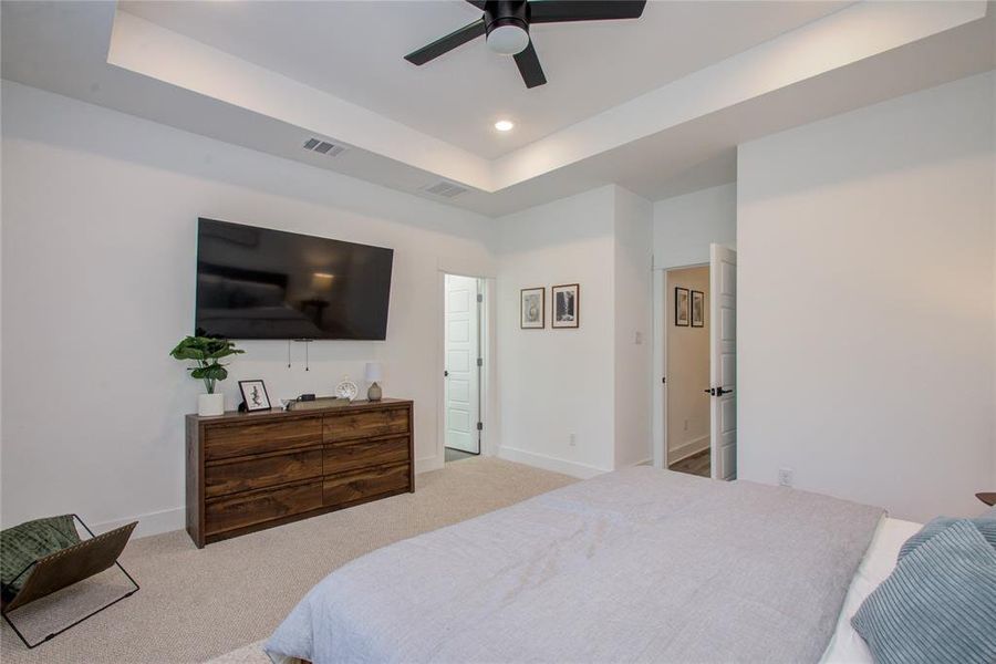 Another view of the spacious Primary bedroom. Model home photos, finishes and floor plan MAY VARY! Ceiling fans are NOT INCLUDED!