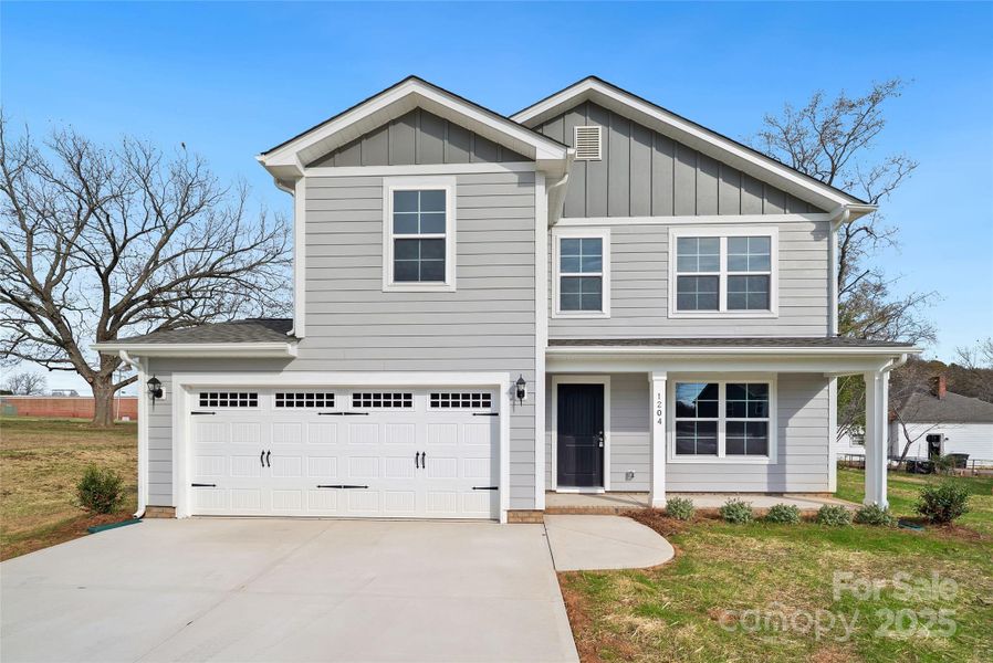 Front exterior of a new home in , Monroe, NC, highlighting curb appeal (Image 23).