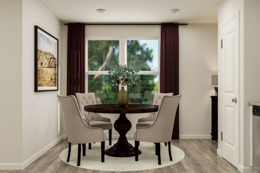 A dining room table with chairs.
