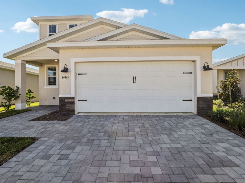 Front exterior of a new home in Crescent Lakes - Premier Series, Punta Gorda, FL, highlighting curb appeal (Image 2).