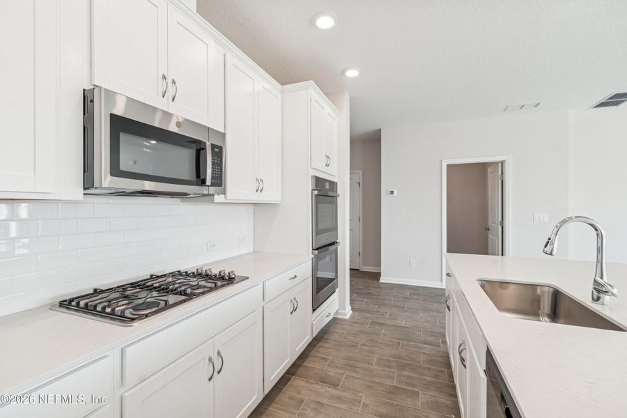 Furnished interior view inside a new home in Tributary 50', Yulee (Image 11).