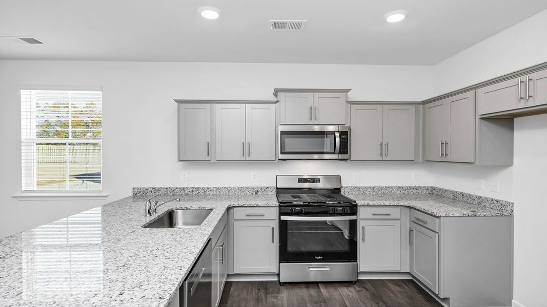 Representative furnished interior of a home built from the CAMERON by D.R. Horton in Hunter's Branch, Hopkins (Image 6).