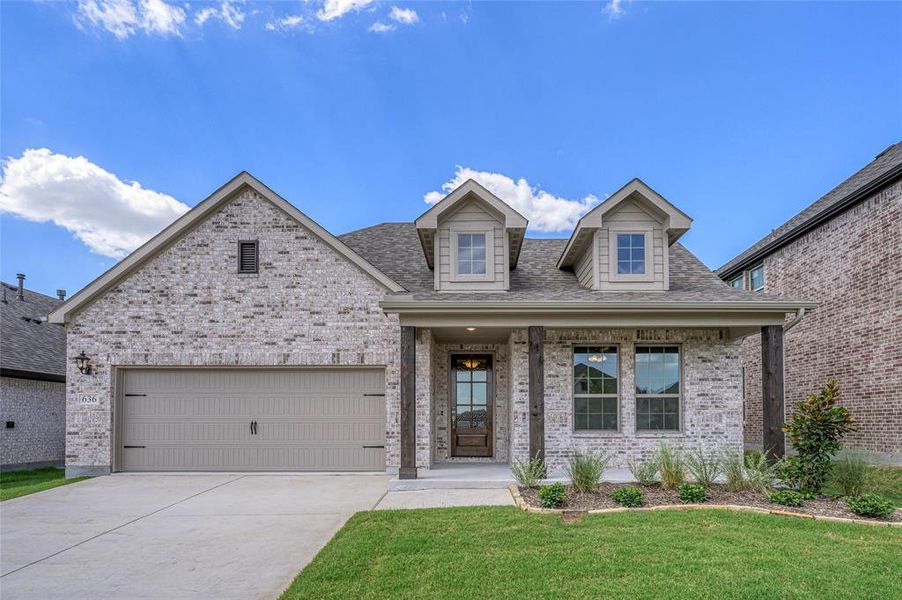 View of front facade with a porch, brick siding, a front lawn, driveway, and an attached garage View of front facade with a porch, brick siding, a front lawn, driveway, and an attached garage
