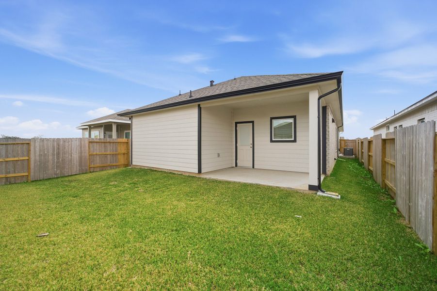 Exterior details and patio area of a home in Windrose Green, Angleton (Image 3).