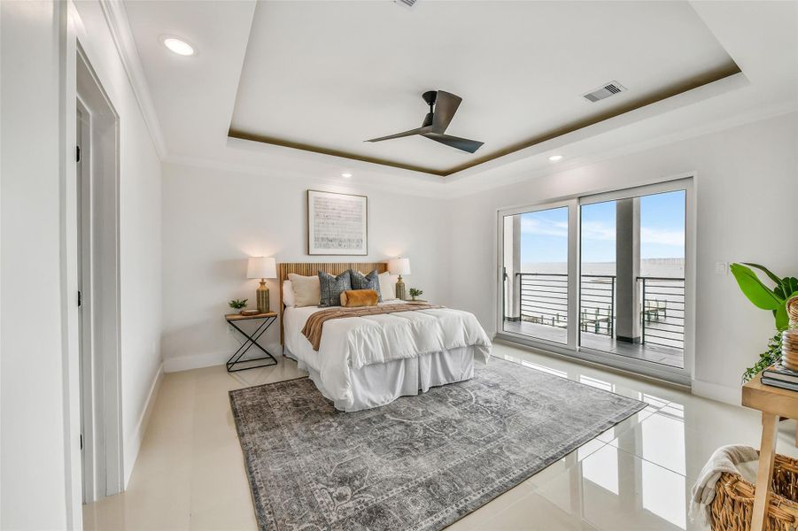 The first-floor primary suite offers privacy and convenience on the main level. Its generous proportions and deck access create a personal retreat connected to the waterfront lifestyle. The first-floor primary suite offers privacy and convenience on the main level. Its generous proportions and deck access create a personal retreat connected to the waterfront lifestyle.