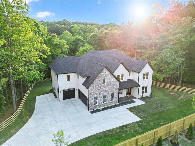 Front exterior of a new home in , Dacula, GA, highlighting curb appeal (Image 1). Front exterior of a new home in , Dacula, GA, highlighting curb appeal (Image 1).