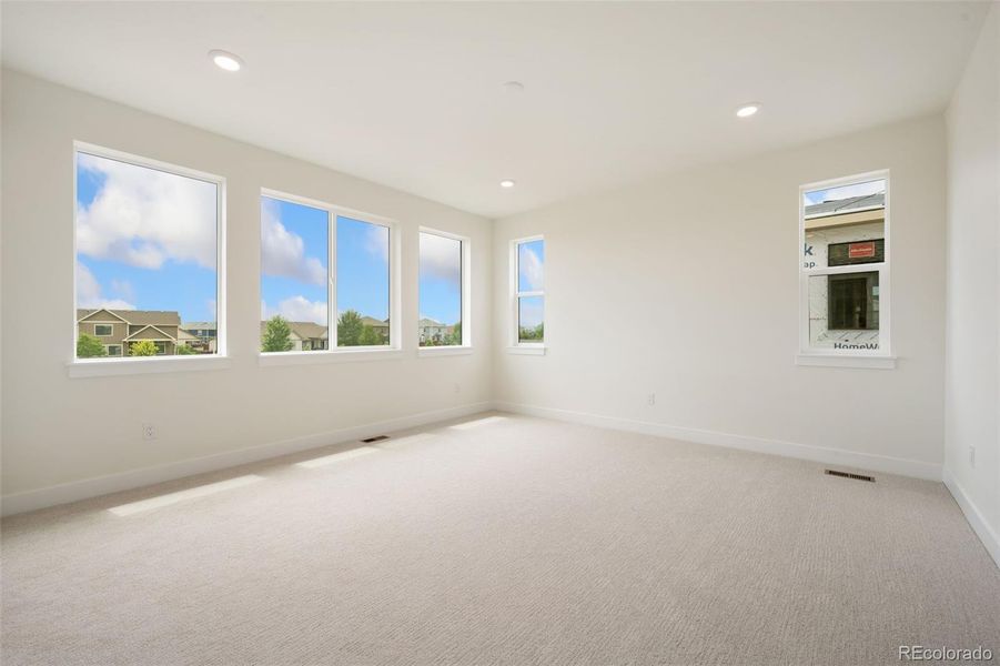 Spacious, unfurnished interior of a new home in Festival at RainDance, Windsor (Image 9).