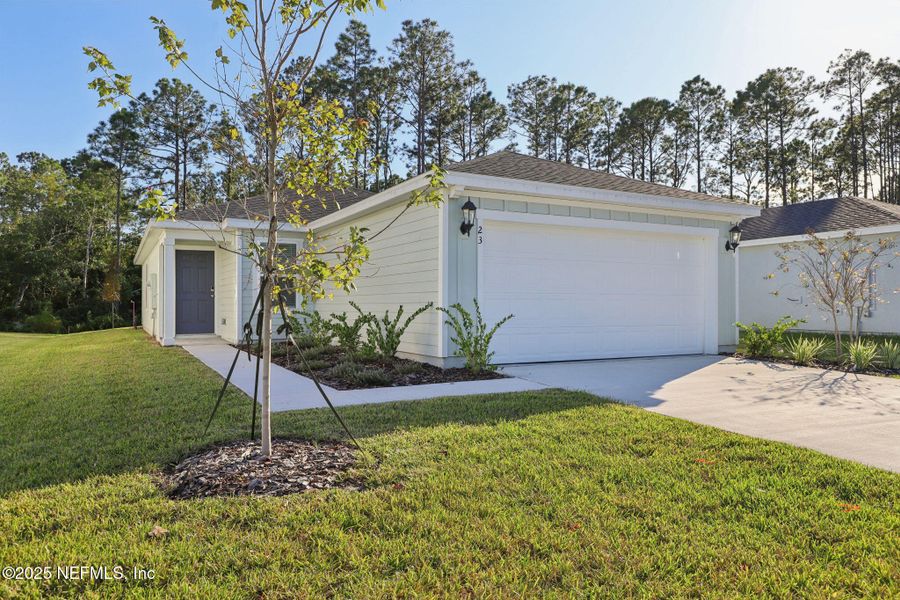 Exterior details and patio area of a home in Flagler Village - Classic Series, Palm Coast (Image 18).