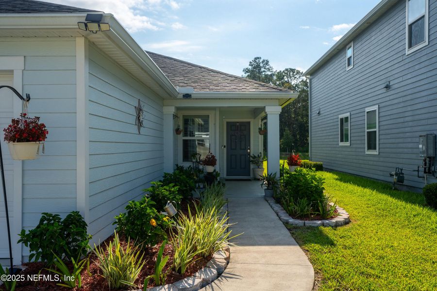 Front exterior of a new home in Brookside Preserve, St. Johns, FL, highlighting curb appeal (Image 1).