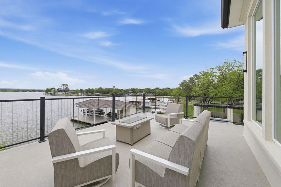 View of patio featuring outdoor furniture and a water view