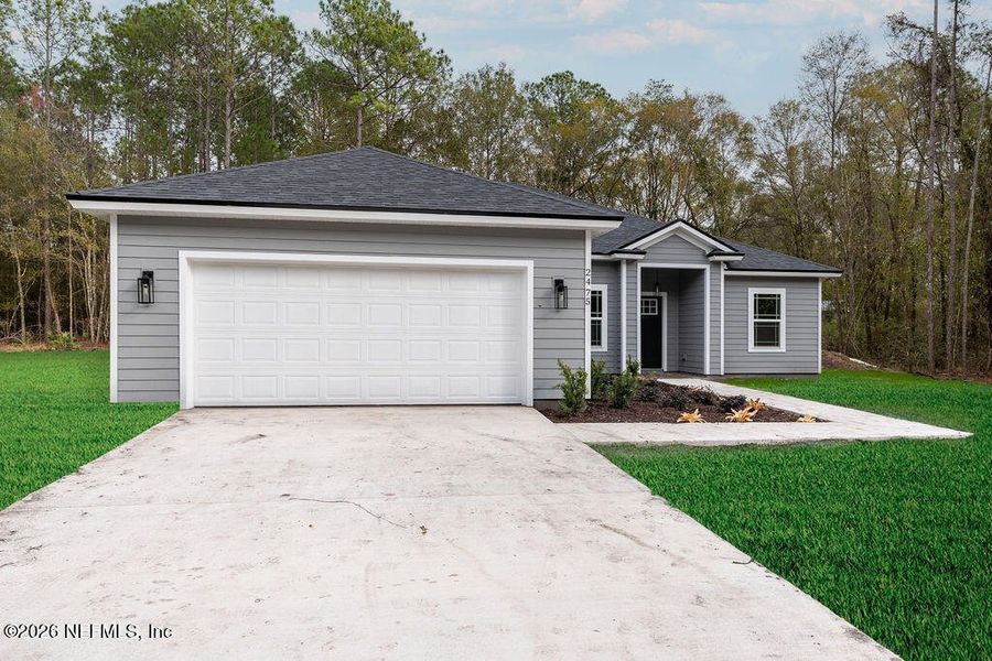 Front exterior of a new home in , Middleburg, FL, highlighting curb appeal (Image 17). Front exterior of a new home in , Middleburg, FL, highlighting curb appeal (Image 17).