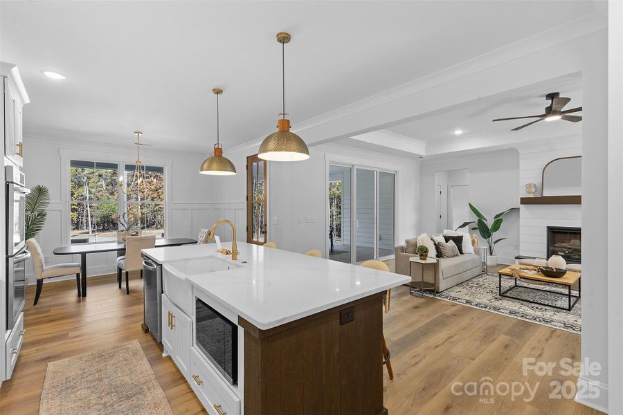 *representative photo- gourmet kitchen w/ custom wood hood vent, double oven, microwave built into the island, oversized level 3 quartz countertops, porcelain farmhouse sink
