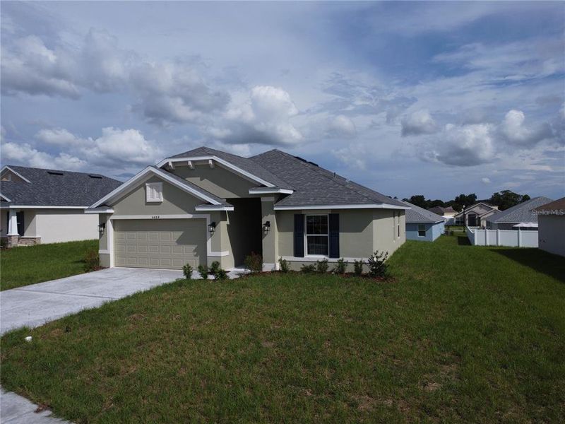 Front exterior of a new home in , Ocala, FL, highlighting curb appeal (Image 2). Front exterior of a new home in , Ocala, FL, highlighting curb appeal (Image 2).