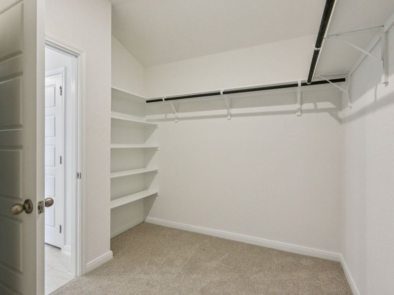 Primary suite walk-in closet in the Allen floorplan at a Meritage Homes community. Primary suite walk-in closet in the Allen floorplan at a Meritage Homes community.