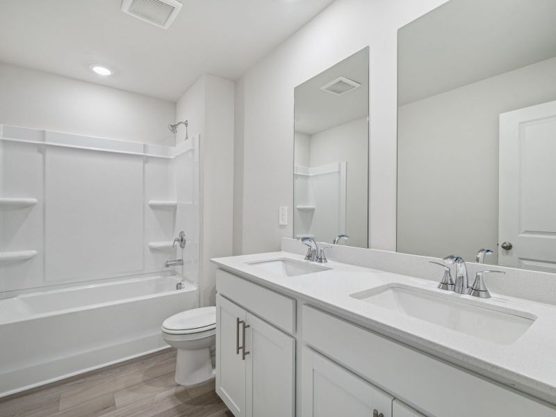 Furnished interior view inside a new home in Northwoods at Mirror Lake, Villa Rica (Image 10).