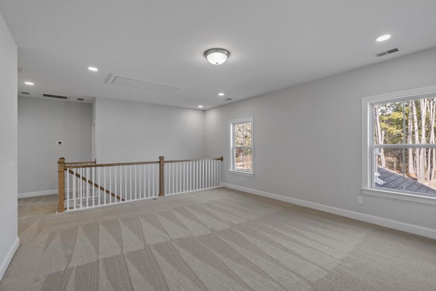 Spacious, unfurnished interior of a new home in K. Hovnanian's® Four Seasons at Lakes of Cane Bay, Summerville (Image 23).