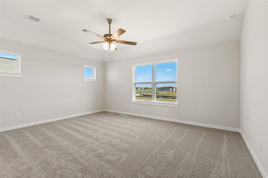 Spacious, unfurnished interior of a new home in Sunterra, Katy (Image 28).