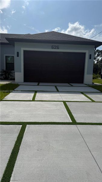 Front exterior of a new home in , Lehigh Acres, FL, highlighting curb appeal (Image 35).