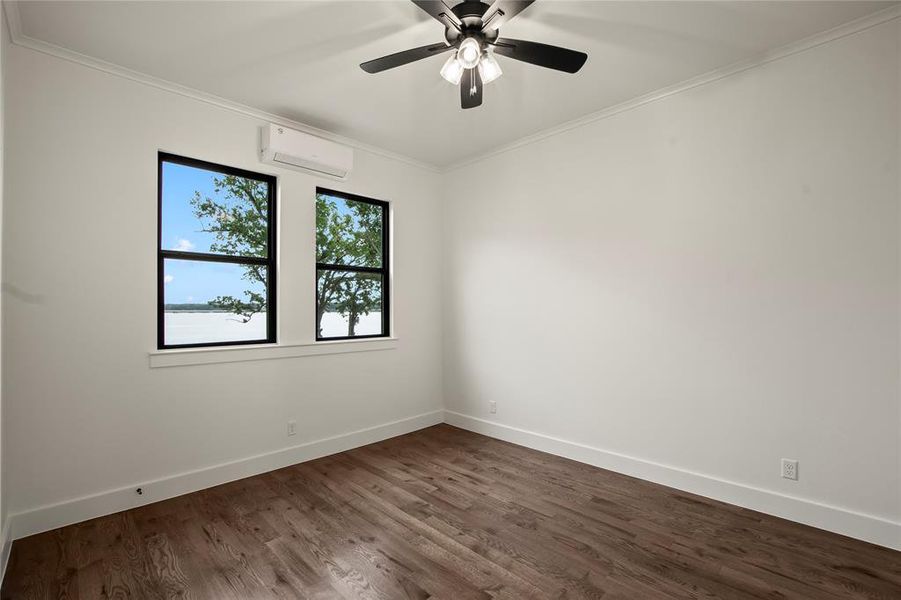 Guest Quarters Bedroom with waterviews, wood floors, and walk in closet. Guest Quarters Bedroom with waterviews, wood floors, and walk in closet.