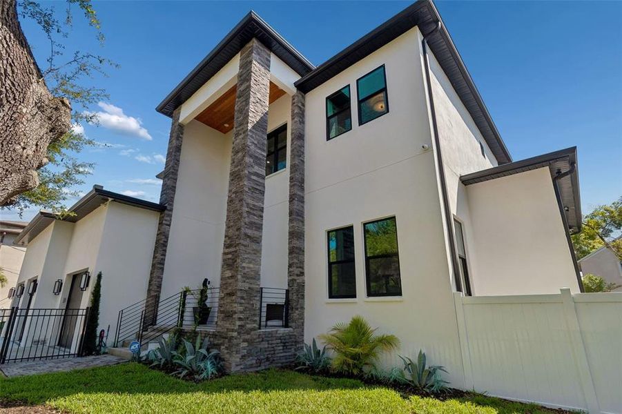 Front exterior of a new home in , Tampa, FL, highlighting curb appeal (Image 1). Front exterior of a new home in , Tampa, FL, highlighting curb appeal (Image 1).