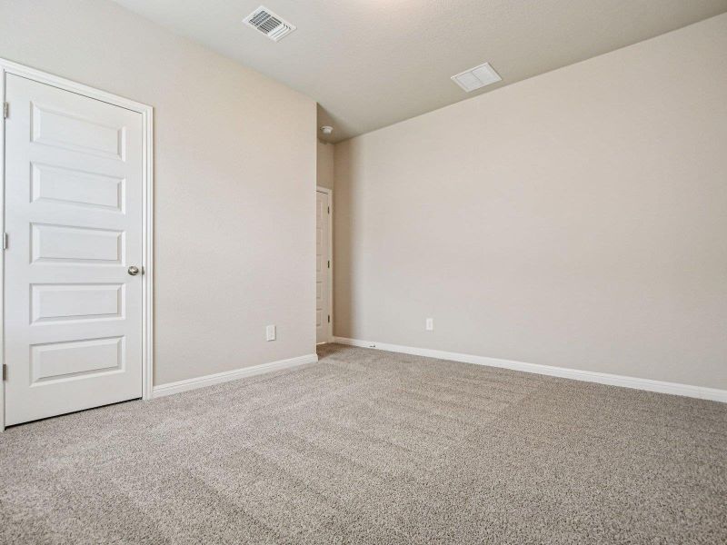 Spare room featuring carpet flooring and baseboards Spare room featuring carpet flooring and baseboards