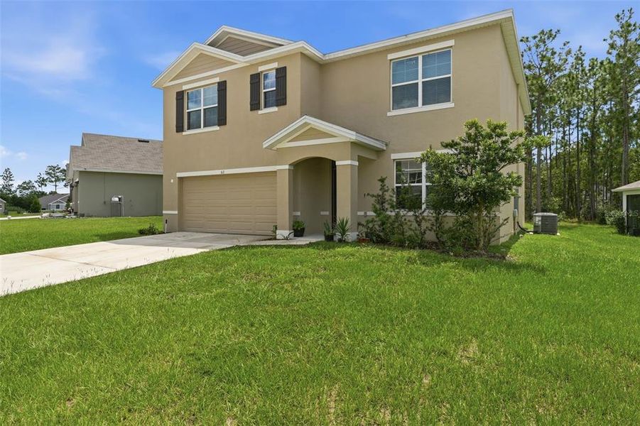 Front exterior of a new home in Lake Diamond, Ocala, FL, highlighting curb appeal (Image 28).