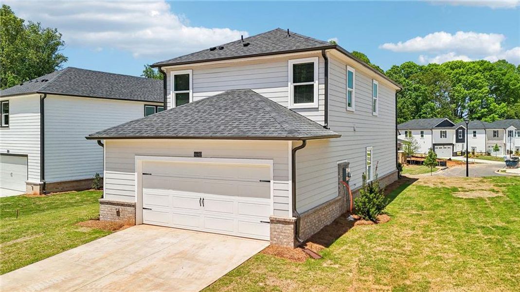 Front exterior of a new home in Hemingway - Cottage Series, Cumming, GA, highlighting curb appeal (Image 26). Front exterior of a new home in Hemingway - Cottage Series, Cumming, GA, highlighting curb appeal (Image 26).