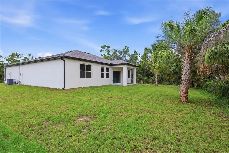 Exterior details and patio area of a home in , North Port (Image 19).